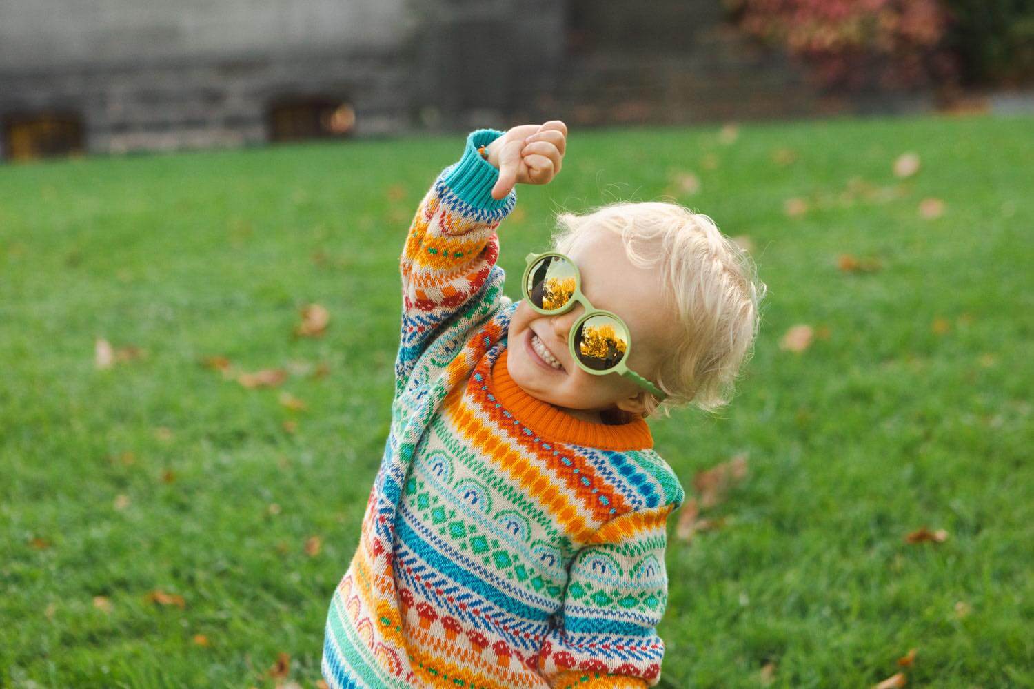 Child wearing the best baby, kids and children polarised sunglasses in green colour, in southbank, melbourne.